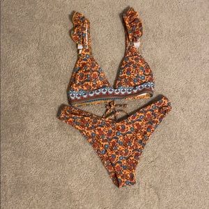 orange patterned swimsuit.